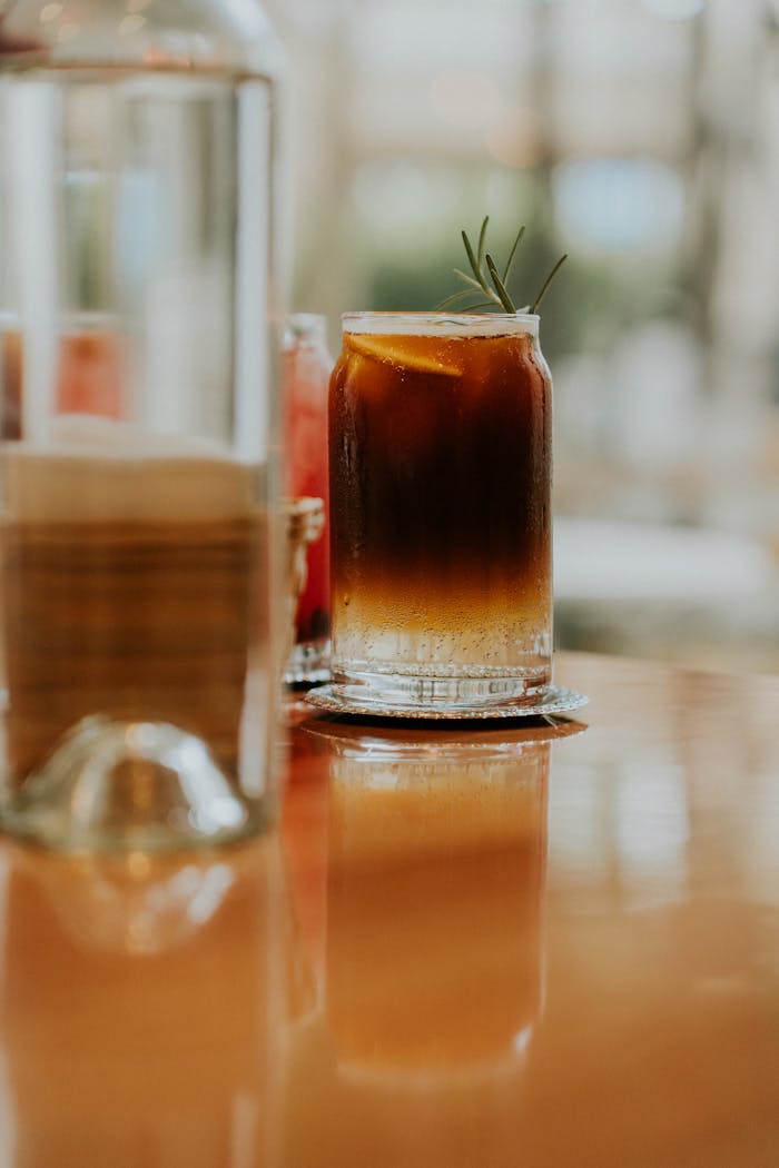 A glass of iced coffee sits on a table